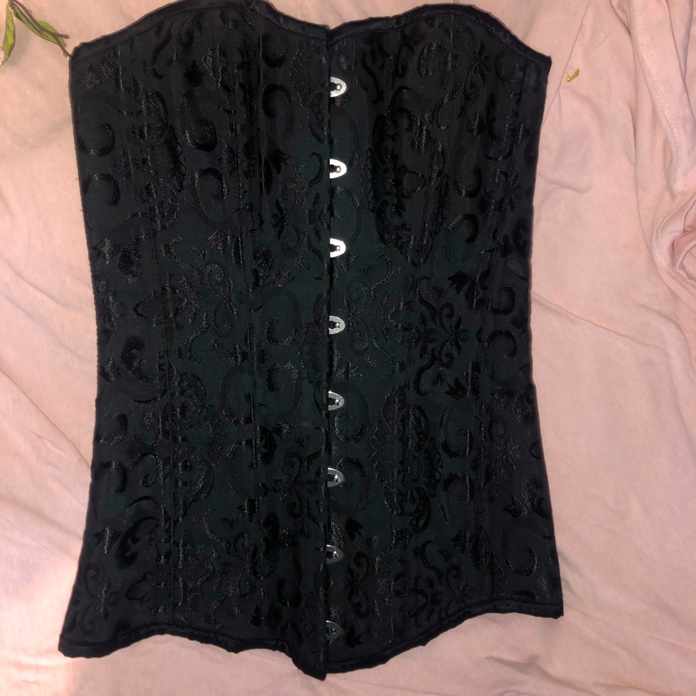 Corset the brand is Charmain brand new worn once